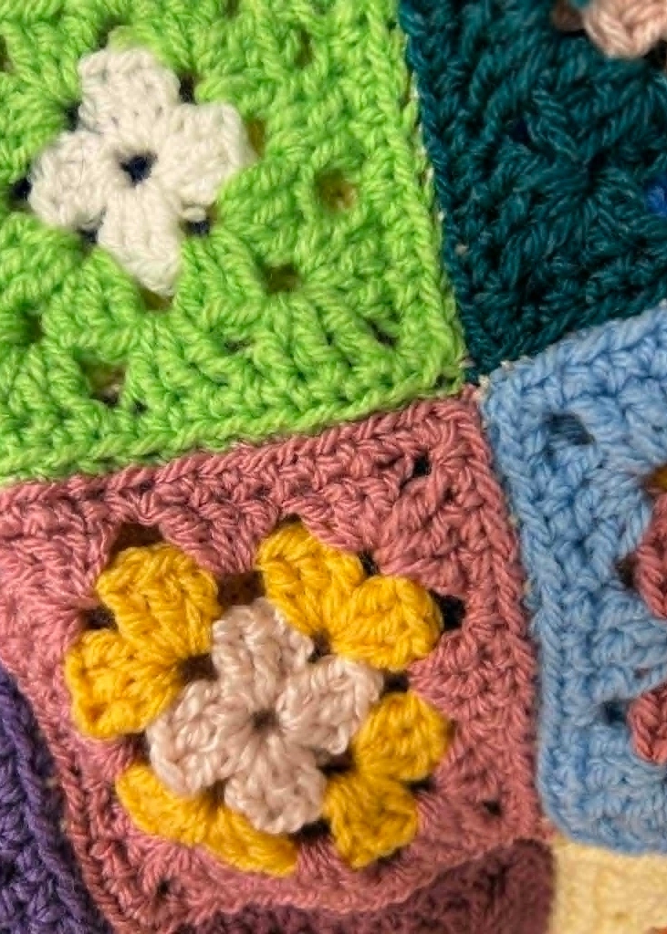 Hand‑crocheted granny square blanket made for the Swindon Big Knit Blankets of Hope project, featuring colourful joined motifs.