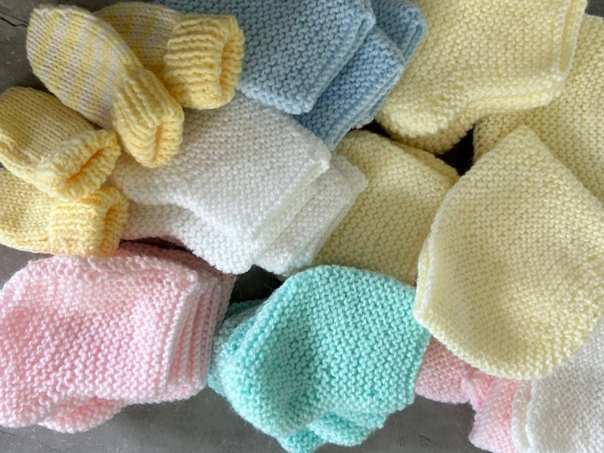 Hand knitted baby clothes made by Swindon Big Knit March 2026