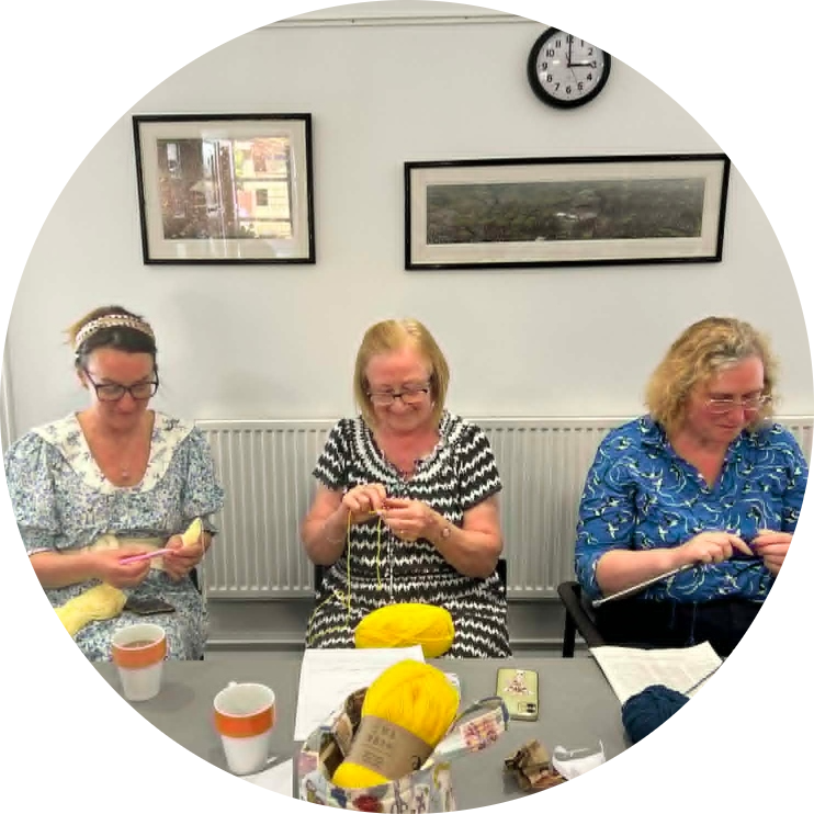 Local crafters from the Swindon Big Knit group crocheting and working on their projects during the afternoon meet‑up.